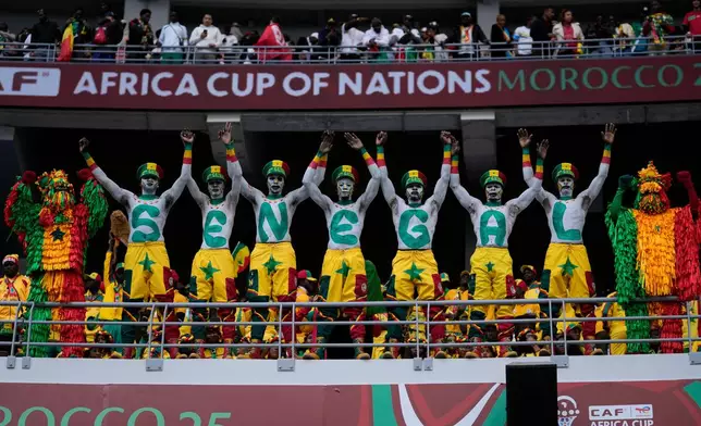 Senegal fans support their national team during the Africa Cup of Nations group D soccer match between Senegal and DR Congo in Tangier, Morocco, Saturday, Dec. 27, 2025. (AP Photo/Themba Hadebe)