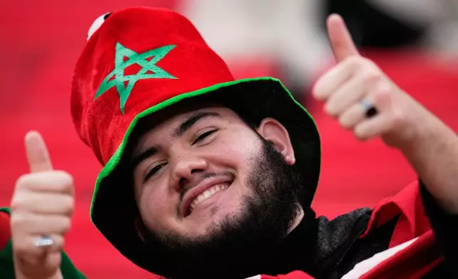 A Moroccan fan waits for the start of the Africa Cup of Nations group A soccer match between Zambia and Morocco in Rabat, Morocco, Monday, Dec. 29, 2025. (AP Photo/Themba Hadebe)