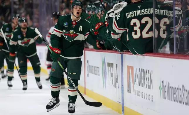 Minnesota Wild center Joel Eriksson Ek (14) celebrates his goal against the Ottawa Senators during the third period of an NHL hockey game Saturday, Dec. 13, 2025, in St. Paul, Minn. (AP Photo/Matt Krohn)