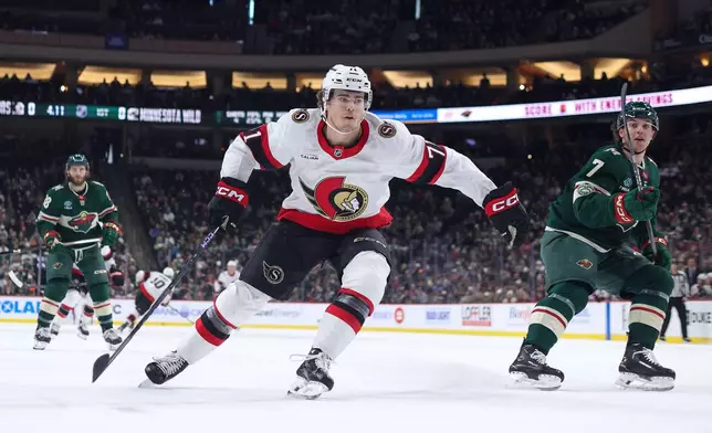 Ottawa Senators center Ridly Greig (71) skates after the puck with Minnesota Wild during the first period of an NHL hockey game Saturday, Dec. 13, 2025, in St. Paul, Minn. (AP Photo/Matt Krohn)