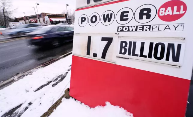 The jackpot for the Powerball lottery game is displayed outside Ted's State Line Mobil station, Wednesday, Dec. 24, 2025, in Methuen, Mass. (AP Photo/Charles Krupa)