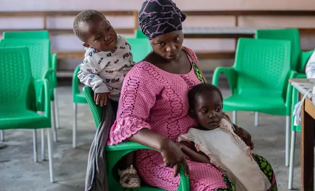 Irene Nabudeba, pregnant, mother of 5, waits for a consultation that used to be free at the Afia Himbi Hospital in Goma, Democratic Republic of Congo, Nov. 11, 2025. (AP Photo/Moses Sawasawa)