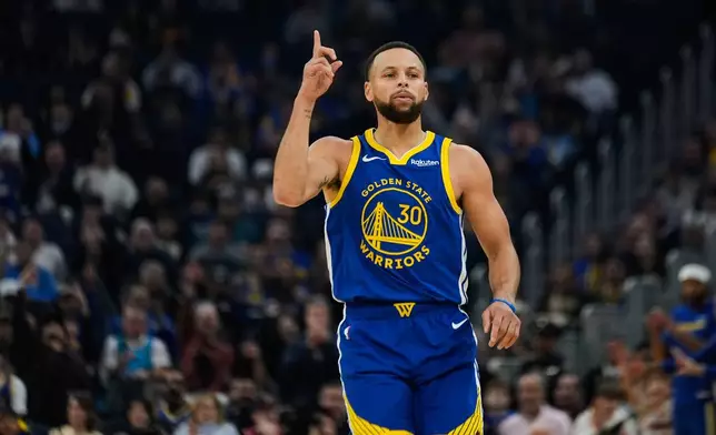 Golden State Warriors guard Stephen Curry (30) celebrates after making a 3-point basket during the first half of an NBA basketball game against the Minnesota Timberwolves, Friday, Dec. 12, 2025, in San Francisco. (AP Photo/Godofredo A. Vásquez)