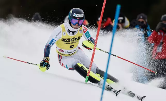 Norway's Atle Lie McGrath speeds down the course during an alpine ski, men's World Cup slalom, in Alta Badia, Italy, Monday, Dec. 22, 2025. (AP Photo/Gabriele Facciotti)