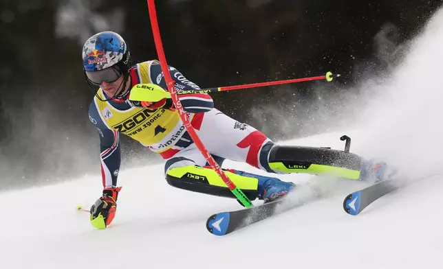 France's Clement Noel speeds down the course during an alpine ski, men's World Cup slalom, in Alta Badia, Italy, Monday, Dec. 22, 2025. (AP Photo/Alessandro Trovati)