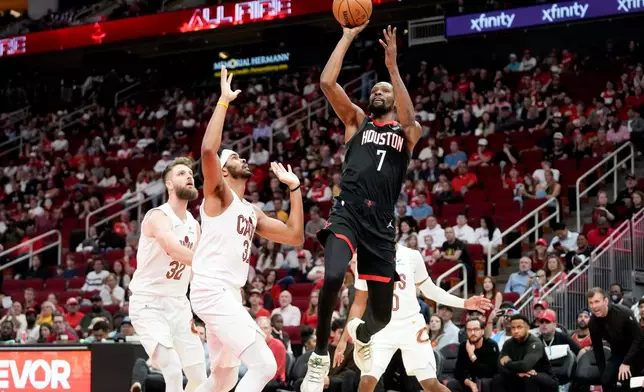Houston Rockets forward Kevin Durant (7) shoots as Cleveland Cavaliers center Jarrett Allen, left, defends during the first half of an NBA basketball game Saturday, Dec. 27, 2025, in Houston. (AP Photo/Eric Christian Smith)