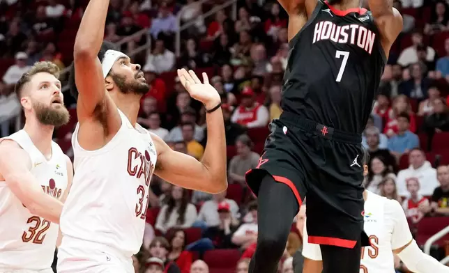 Houston Rockets forward Kevin Durant (7) shoots as Cleveland Cavaliers center Jarrett Allen, left, defends during the first half of an NBA basketball game Saturday, Dec. 27, 2025, in Houston. (AP Photo/Eric Christian Smith)