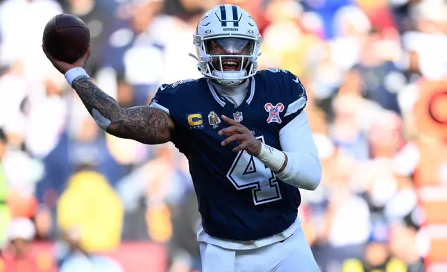 Dallas Cowboys quarterback Dak Prescott throws during the first half an NFL football game against the Washington Commanders Thursday, Dec. 25, 2025, in Landover, Md. (AP Photo/Nick Wass)