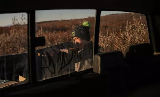 James Schaeffer, 7, hunts in Kotzebue, Alaska, Friday, Sept. 26, 2025. (AP Photo/Annika Hammerschlag)