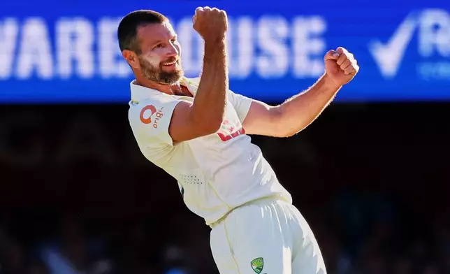 Australia's Michael Neser celebrates the wicket of England's Zak Crawley during the second Ashes cricket test match between Australia and England in Brisbane, Thursday, Dec. 4, 2025.. (AP Photo/Tertius Pickard)