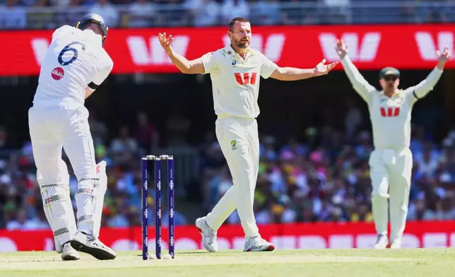 Australia's Michael Neser, centre, appeals unsuccessfully for the wicket of England's Zak Crawley during the second Ashes cricket test match between Australia and England in Brisbane, Thursday, Dec. 4, 2025.. (AP Photo/Tertius Pickard)