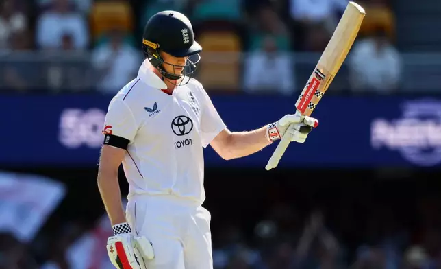 England's Zak Crawley celebrates his fifty runs during the second Ashes cricket test match between Australia and England in Brisbane, Thursday, Dec. 4, 2025.. (AP Photo/Tertius Pickard)