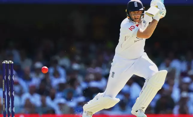 England's Joe Root plays a shot during the second Ashes cricket test match between Australia and England in Brisbane, Thursday, Dec. 4, 2025.. (AP Photo/Tertius Pickard)