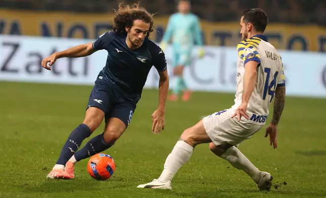 Lazio's Matteo Elias Guendouzi Olie', left, and Parma's Emanuele Valeri in action during the Serie A soccer match between Parma and Lazio at the Ennio Tardini in Parma, Italy, Saturday Dec. 13, 2025. (Gianni Santandrea/LaPresse via AP)