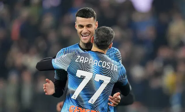 Atalanta's Gianluca Scamacca, left, celebrates after scoring the opening goal during the Serie A soccer match between Atalanta Bergamo and Cagliari Calcio in Bergamo, Italy, Saturday Dec. 13, 2025. (Spada/LaPresse via AP)