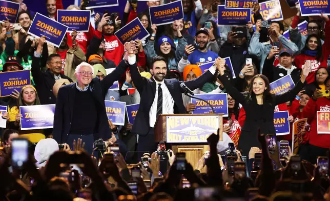 FILE - Sen. Bernie Sanders, I-Vt., left, New York City mayoral candidate Zohran Mamdani, center, and Rep. Alexandria Ocasio-Cortez, D-N.Y., appear on stage during a rally, Sunday, Oct. 26, 2025, in New York. (AP Photo/Heather Khalifa, File)