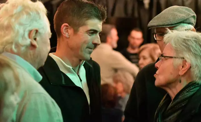 Ryan Crosswell, a former federal prosecutor who quit the Department of Justice in protest, speaks to attendees at a campaign event for his run for Congress, Dec. 4, 2025, in Allentown, Pa. (AP Photo/Marc Levy)