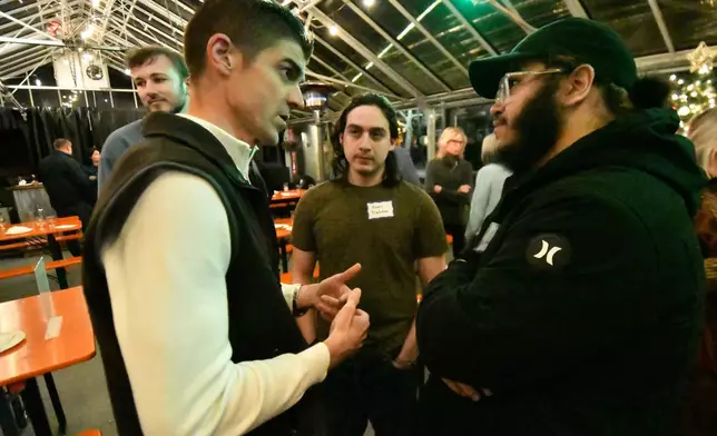 Ryan Crosswell, a former federal prosecutor who quit the Department of Justice in protest, speaks to attendees at a campaign event for his run for Congress, Dec. 4, 2025, in Allentown, Pa. (AP Photo/Marc Levy)