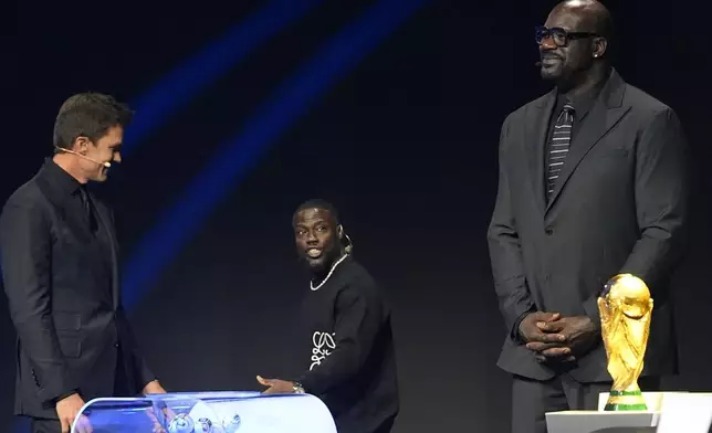 Former NBA player Shaquille O'Neal, actor Kevin Hart and former NFL player Tom Brady attend the draw for the 2026 soccer World Cup at the Kennedy Center in Washington, Friday, Dec. 5, 2025. (AP Photo/Jacquelyn Martin)
