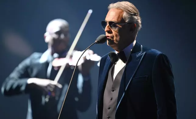 Singer Andrea Bocelli performs at the draw for the 2026 soccer World Cup at the Kennedy Center in Washington, Friday, Dec. 5, 2025. (Mandel Ngan/Pool Photo via AP)