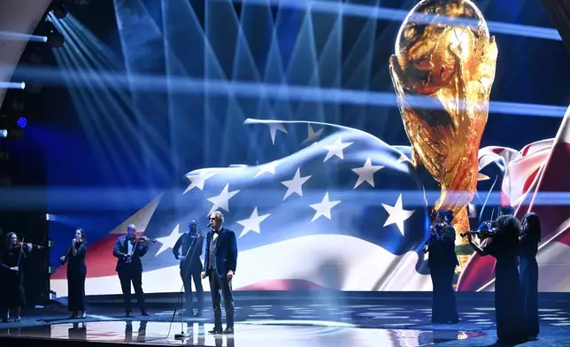 Singer Andrea Bocelli performs at the draw for the 2026 soccer World Cup at the Kennedy Center in Washington, Friday, Dec. 5, 2025. (Mandel Ngan/Pool Photo via AP)