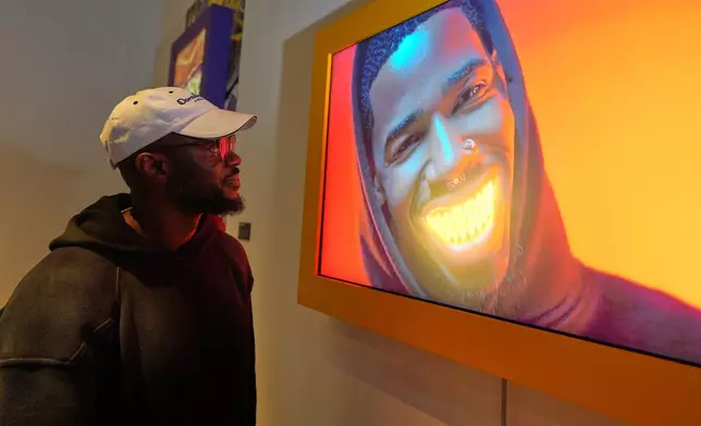 Willonius Hatcher, also known as King Willonius, with his presentation entitled "I'm McLovin It (Popeye’s Diss Song)” at the a16z AI Creative Gallery, Thursday, Sept. 18, 2025, in New York. (AP Photo/Frank Franklin II)