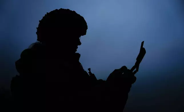 A Ukrainian drone operator from the Kraken 1654 unit, callsign Imla, flies a Vampire drone during a demonstration for The Associated Press, Wednesday, Nov. 5, 2025, in Kharkiv Oblast, Ukraine. (AP Photo/Julia Demaree Nikhinson)