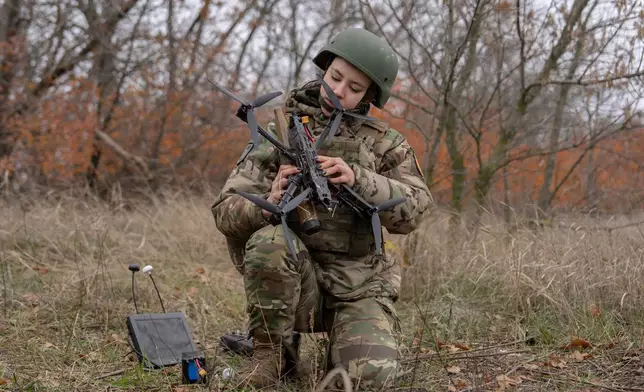 Monka, an FPV drone operator from the third assault brigade, assembles an FPV drone during a demonstration for The Associated Press, Wednesday, Nov. 5, 2025, in Kharkiv Oblast, Ukraine. (AP Photo/Julia Demaree Nikhinson)