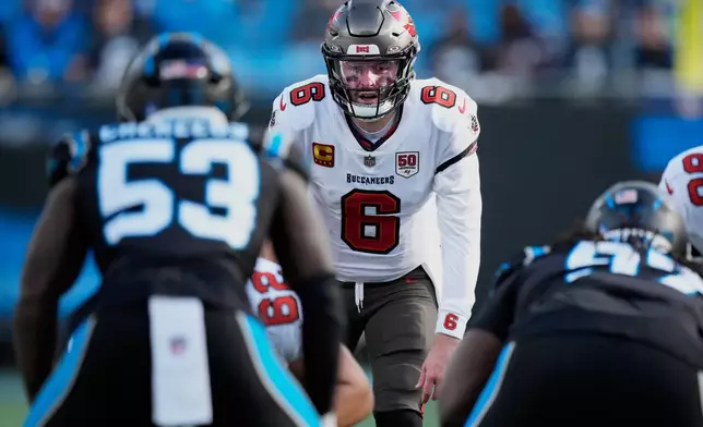 Tampa Bay Buccaneers quarterback Baker Mayfield plays against the Carolina Panthers during the second half of an NFL football game, Sunday, Dec. 21, 2025, in Charlotte, N.C. (AP Photo/Jacob Kupferman)