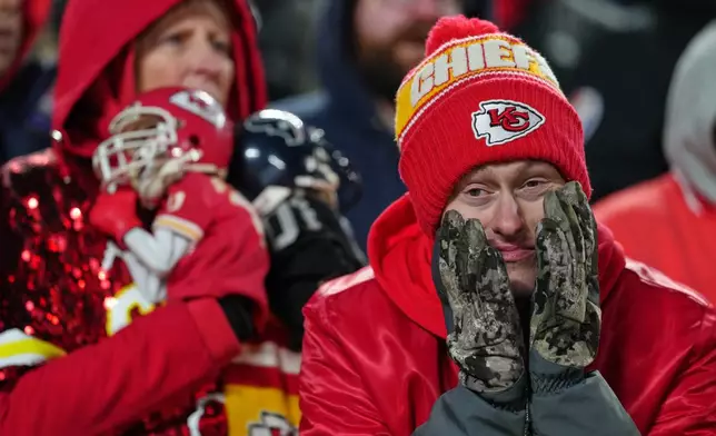 Kansas City Chiefs fans react late in the second half of an NFL football game between the Kansas City Chiefs and the Houston Texans Sunday, Dec. 7, 2025, in Kansas City, Mo. (AP Photo/Ed Zurga)