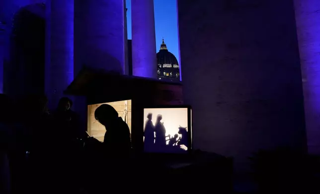 A Christmas crib scene is displayed at the International Exhibition "100 Nativity Scenes in the Vatican," which opens in St. Peter's Square on Monday, Dec. 8, 2025, bringing together works by numerous artisans depicting the Nativity. (AP Photo/Gregorio Borgia)