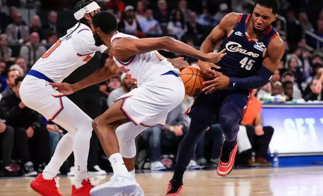 Cleveland Cavaliers guard Donovan Mitchell (45) looses control of the ball during the first half of an NBA basketball game against the New York Knicks, Thursday, Dec. 25, 2025, in New York. (AP Photo/Yuki Iwamura)