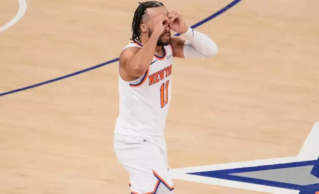 New York Knicks guard Jalen Brunson (11) reacts after scoring a three point goal during the second half of an NBA basketball game against Cleveland Cavaliers, Thursday, Dec. 25, 2025, in New York. (AP Photo/Yuki Iwamura)