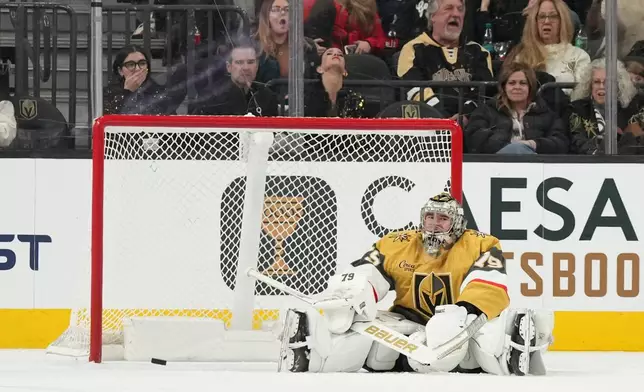 Vegas Golden Knights goaltender Carter Hart reacts to being scored on by Colorado Avalanche center Martin Necas (88) during the second period of an NHL hockey game, Saturday, Dec. 27, 2025, in Las Vegas. (AP Photo/Candice Ward)