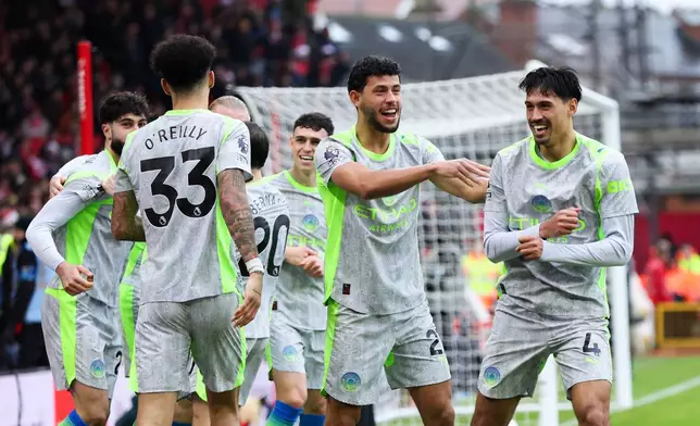 Manchester City's Tijjani Reijnders celebrates scoring the opening goal during the Premier League match between Nottingham Forest and Manchester City, in Nottingham, England, Saturday Dec. 27, 2025. (Barrington Coombs/PA via AP)