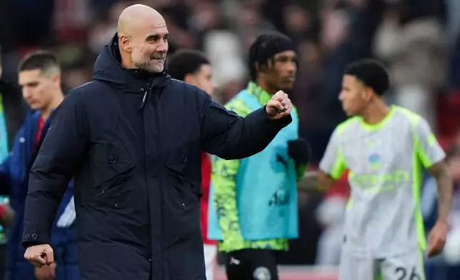Manchester City manager Pep Guardiola celebrates at the end of the Premier League match between Nottingham Forest and Manchester City, in Nottingham, England, Saturday Dec. 27, 2025. (Joe Giddens/PA via AP)