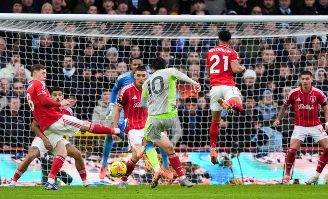 Manchester City's Rayan Cherki scores his side's second goal during the Premier League match between Nottingham Forest and Manchester City, in Nottingham, England, Saturday Dec. 27, 2025. (Joe Giddens/PA via AP)