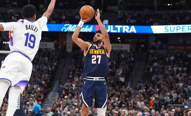 Denver Nuggets guard Jamal Murray, right, shoots for a basket as Utah Jazz forward Ace Bailey defends in the first half of an NBA basketball game Monday, Dec. 22, 2025, in Denver. (AP Photo/David Zalubowski)