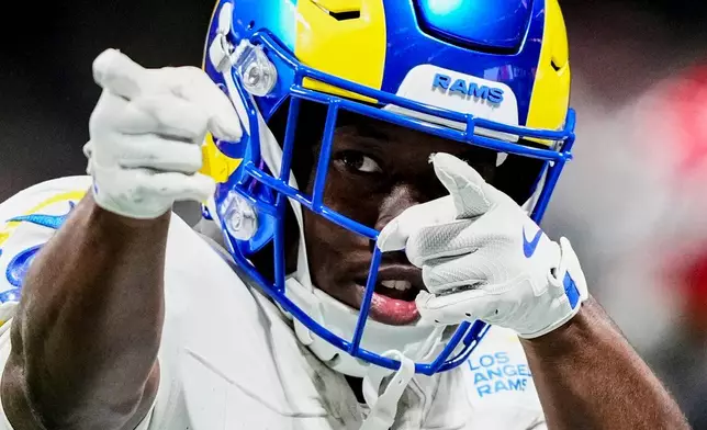 Los Angeles Rams wide receiver Xavier Smith (19) celebrates a first down in the first half of an NFL football game against the Atlanta Falcons, Monday, Dec. 29, 2025, in Atlanta. (AP Photo/Brynn Anderson)