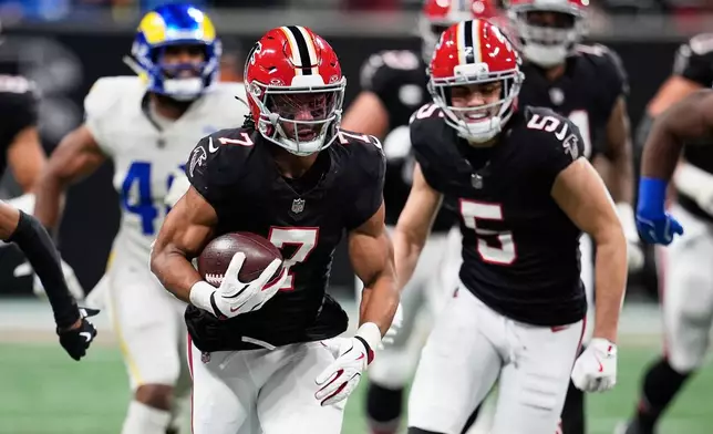 Atlanta Falcons running back Bijan Robinson (7) carries for a long gain in the second half of an NFL football game against the Los Angeles Rams, Monday, Dec. 29, 2025, in Atlanta. (AP Photo/Mike Stewart)