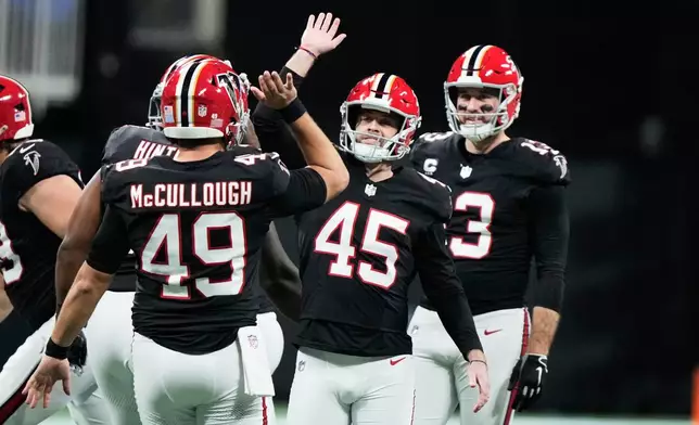 Atlanta Falcons place kicker Zane Gonzalez (45) celebrates his field goal in the second half of an NFL football game against the Los Angeles Rams, Monday, Dec. 29, 2025, in Atlanta. (AP Photo/Brynn Anderson)