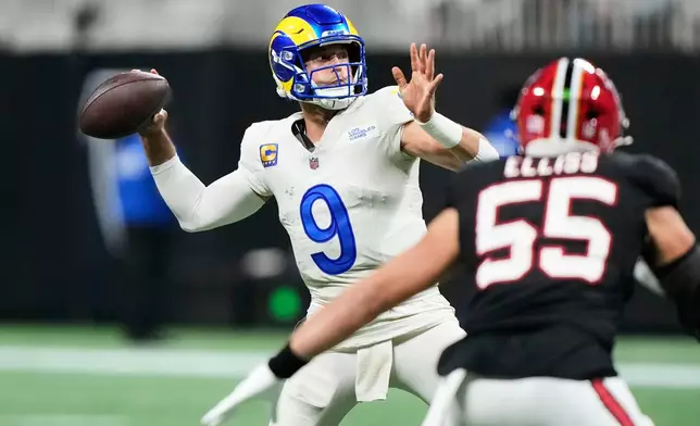 Los Angeles Rams quarterback Matthew Stafford (9) throws a touchdown pass in the second half of an NFL football game against the Atlanta Falcons, Monday, Dec. 29, 2025, in Atlanta. (AP Photo/Brynn Anderson)