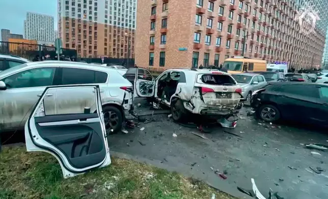 This image taken from video provided by Investigative Committee of Moscow on Monday, Dec. 22, 2025, shows the scene where Lt. Gen. Fanil Sarvarov, head of the Operational Training Directorate of the Russian Armed Forces General Staff, was killed by an explosive device placed under his car in Moscow. (Investigative Committee of Moscow via AP)