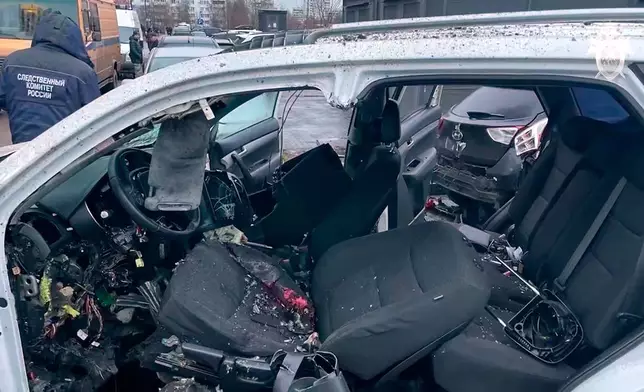 This image taken from video provided by Investigative Committee of Moscow on Monday, Dec. 22, 2025, shows the scene where Lt. Gen. Fanil Sarvarov, head of the Operational Training Directorate of the Russian Armed Forces General Staff, was killed by an explosive device placed under his car in Moscow. (Investigative Committee of Moscow via AP)
