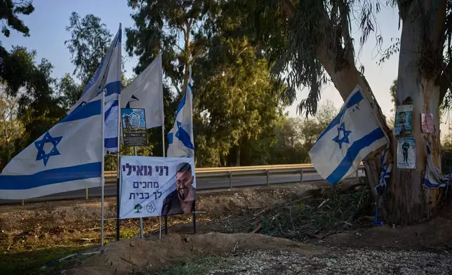FILE - A memorial site at the spot where Ran Gvili, the last hostage in the Gaza Strip, was killed while fighting Hamas militants, stands in Kibbutz Alumim, Israel, Dec. 4, 2025. (AP Photo/Ohad Zwigenberg, File)