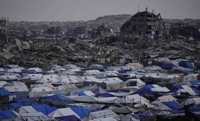 FILE - Tents sheltering displaced Palestinians stand amid the destruction left by the Israeli air and ground offensive in Gaza City Dec. 5, 2025. (AP Photo/Abdel Kareem Hana, File)