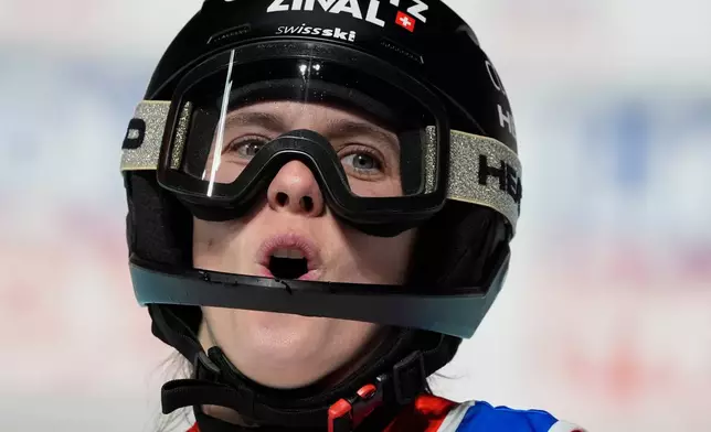 Switzerland's Camille Rast celebrates at the finish area of an alpine ski, women's World Cup slalom, in Courchevel, France, Tuesday, Dec. 16, 2025. (AP Photo/Giovanni Auletta)