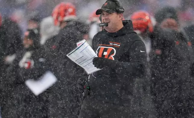 Cincinnati Bengals head coach Zac Taylor looks out from the sideline during the first half of an NFL football game against the Buffalo Bills, Sunday, Dec. 7, 2025, in Orchard Park, N.Y. (AP Photo/Gene J. Puskar)