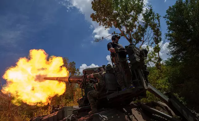 FILE - Ukrainian soldiers, of 43rd artillery brigade, fire by 2s7 self-propelled howitzer towards Russian positions at the frontline in Donetsk region, Ukraine, June 24, 2024. (AP Photo/Evgeniy Maloletka, File)