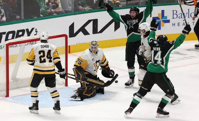 Pittsburgh Penguins goaltender Tristan Jarry (35) looks back after allowing a goal to Dallas Stars defenseman Miro Heiskanen (not shown) during the third period of an NHL hockey game Sunday, Dec. 7, 2025, in Dallas. (AP Photo/Sam Hodde)